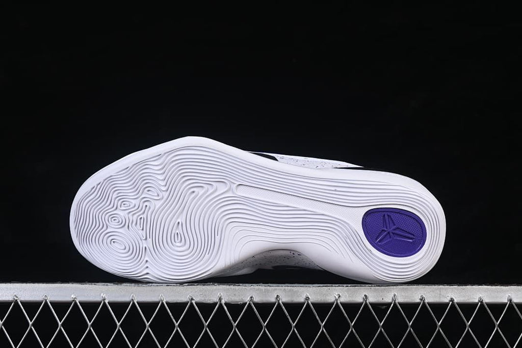 Outsole view showing concentric traction patterns and a purple Kobe emblem