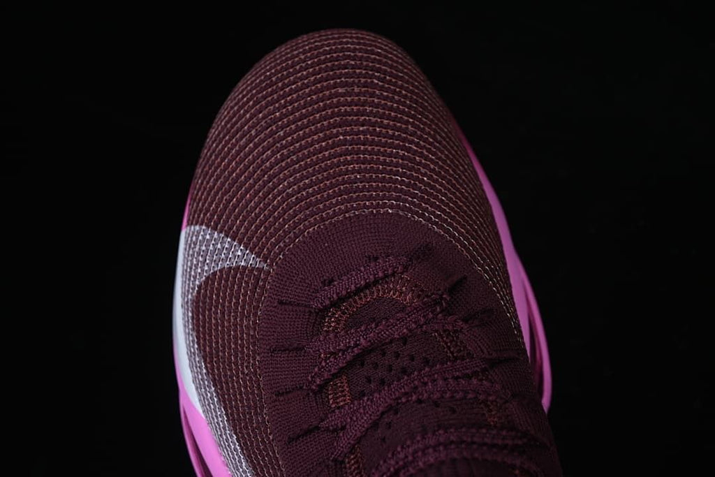 Top-down view of the burgundy shoe toe and laces