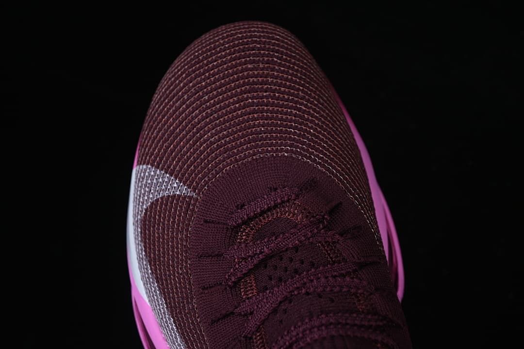 Top-down view of the burgundy shoe toe and laces