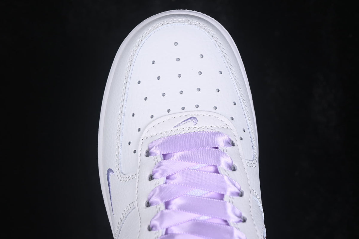 Top view showing the perforated white toe box and lavender laces.