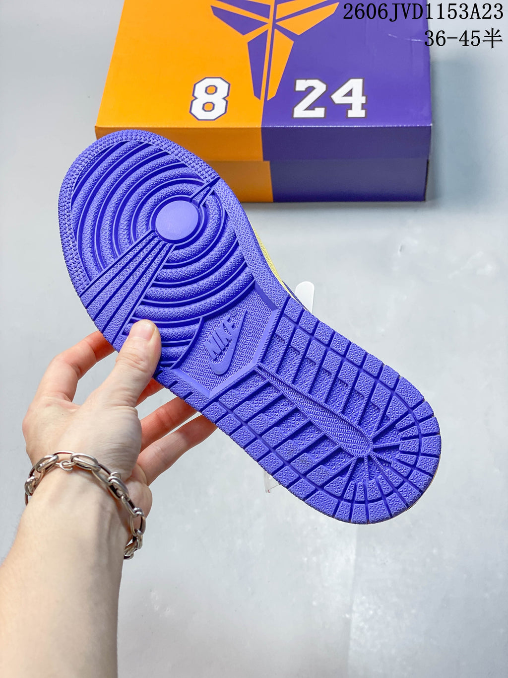 Purple outsole of the yellow low-top sneaker
