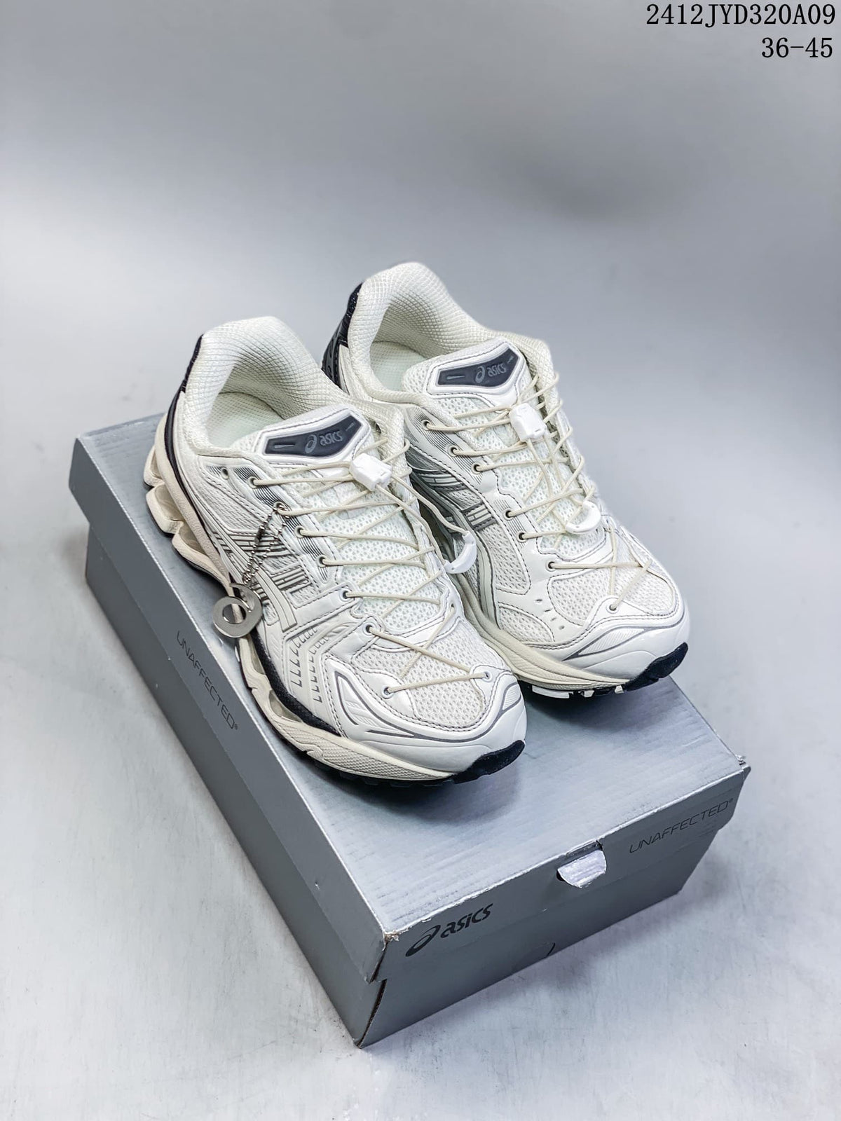 Off-white and silver ASICS GEL-KAYANO 14 sneakers shown from above on a shoebox.
