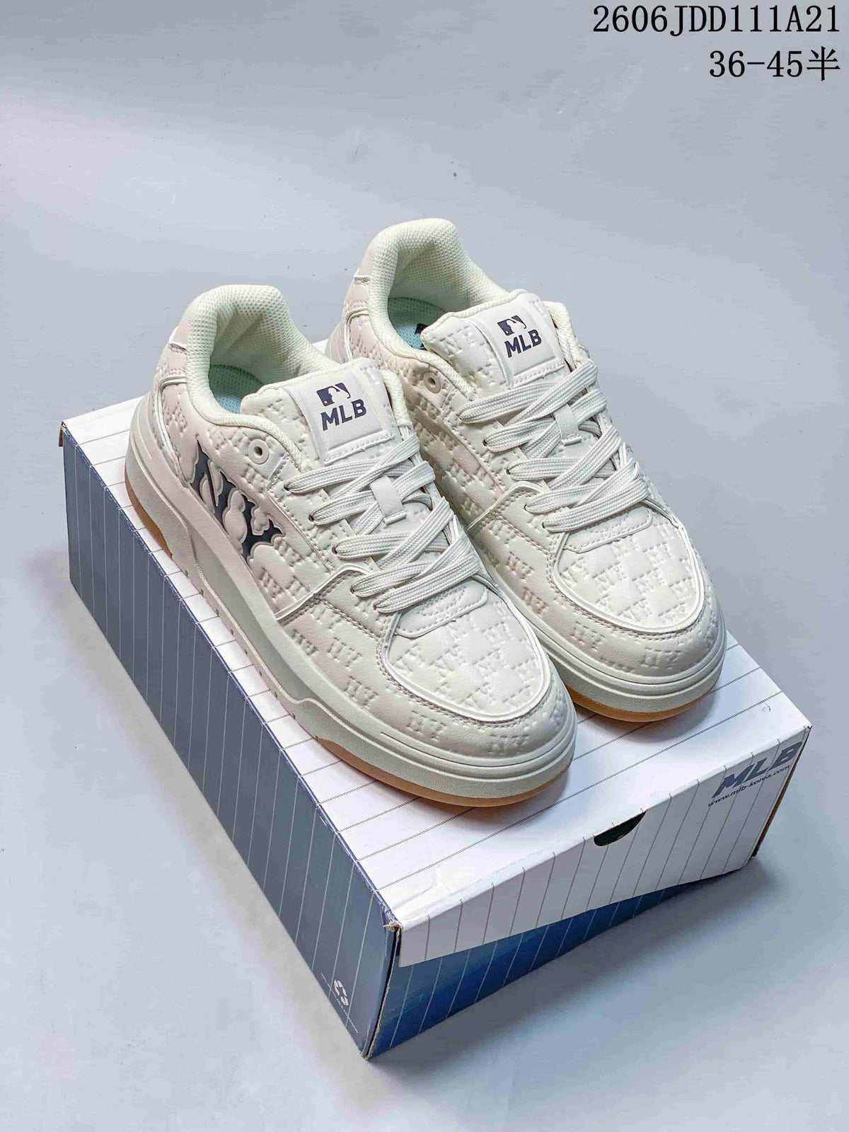 Pair of ivory MLB Chunky Classic monogram sneakers on a shoe box