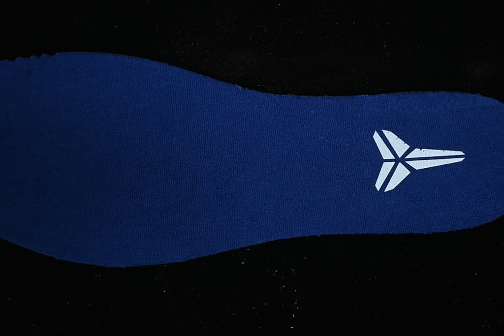 Close-up of a blue shoe insert with a Kobe logo