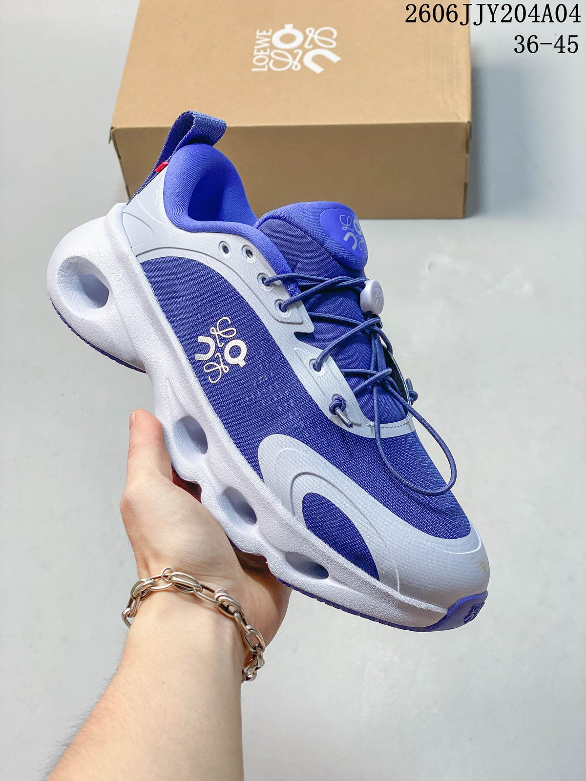 Angled side view of the blue-and-white sneaker with sculpted sole.