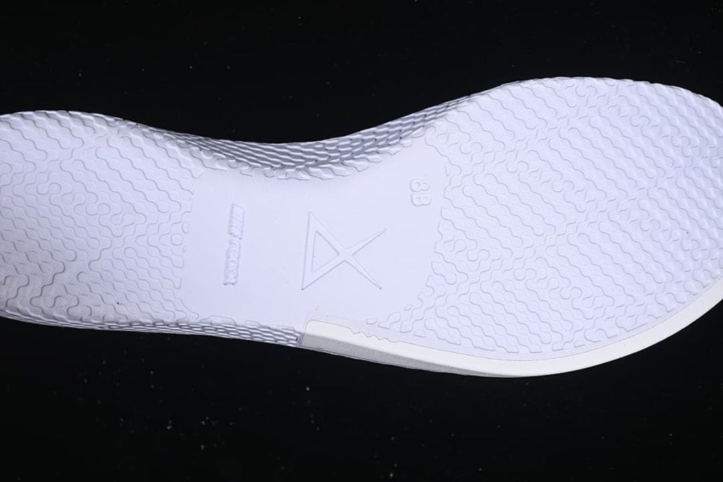 Close-up of textured white shoe insole with Kobe logo