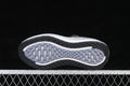 Underside of the Nike Vomero Plus shoe showing its patterned black and gray outsole.
