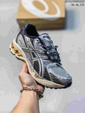 Silver and black ASICS Gel-Nimbus sneaker with mesh panels and a light-colored sole.