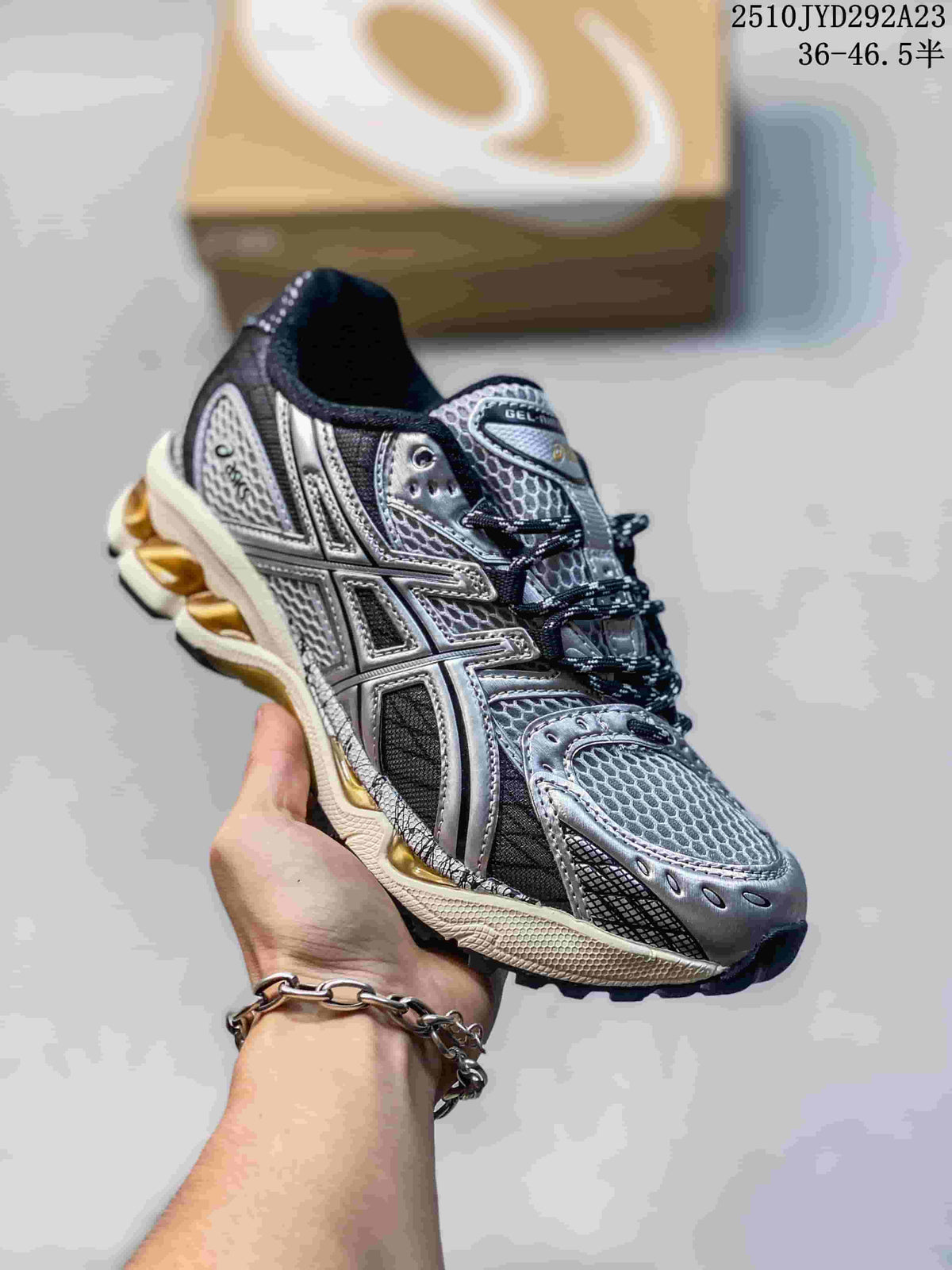 Silver and black ASICS Gel-Nimbus sneaker with mesh panels and a light-colored sole.