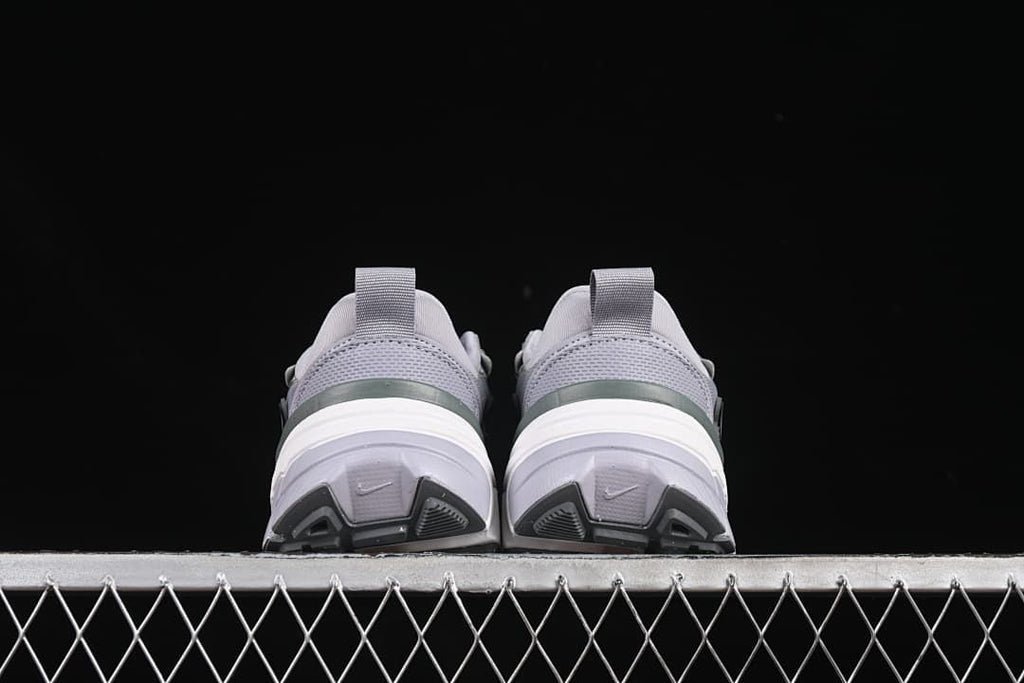 Rear view of the pair showing the heel details and outsoles