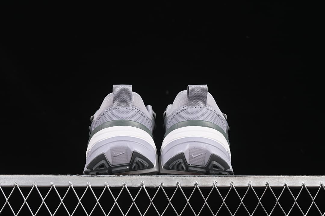 Rear view of the pair showing the heel details and outsoles