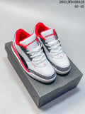 Pair of white, red, and navy low-top Jordan sneakers with elephant-print toe trim on a shoe box