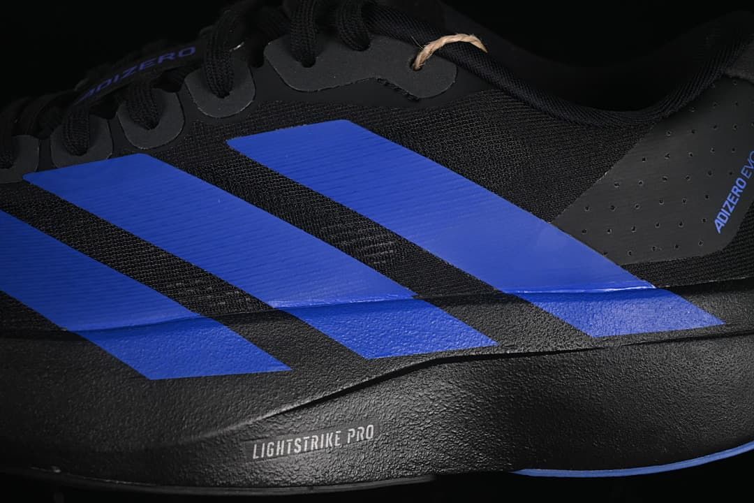 Close-up of blue side stripes and Lightstrike Pro midsole lettering.