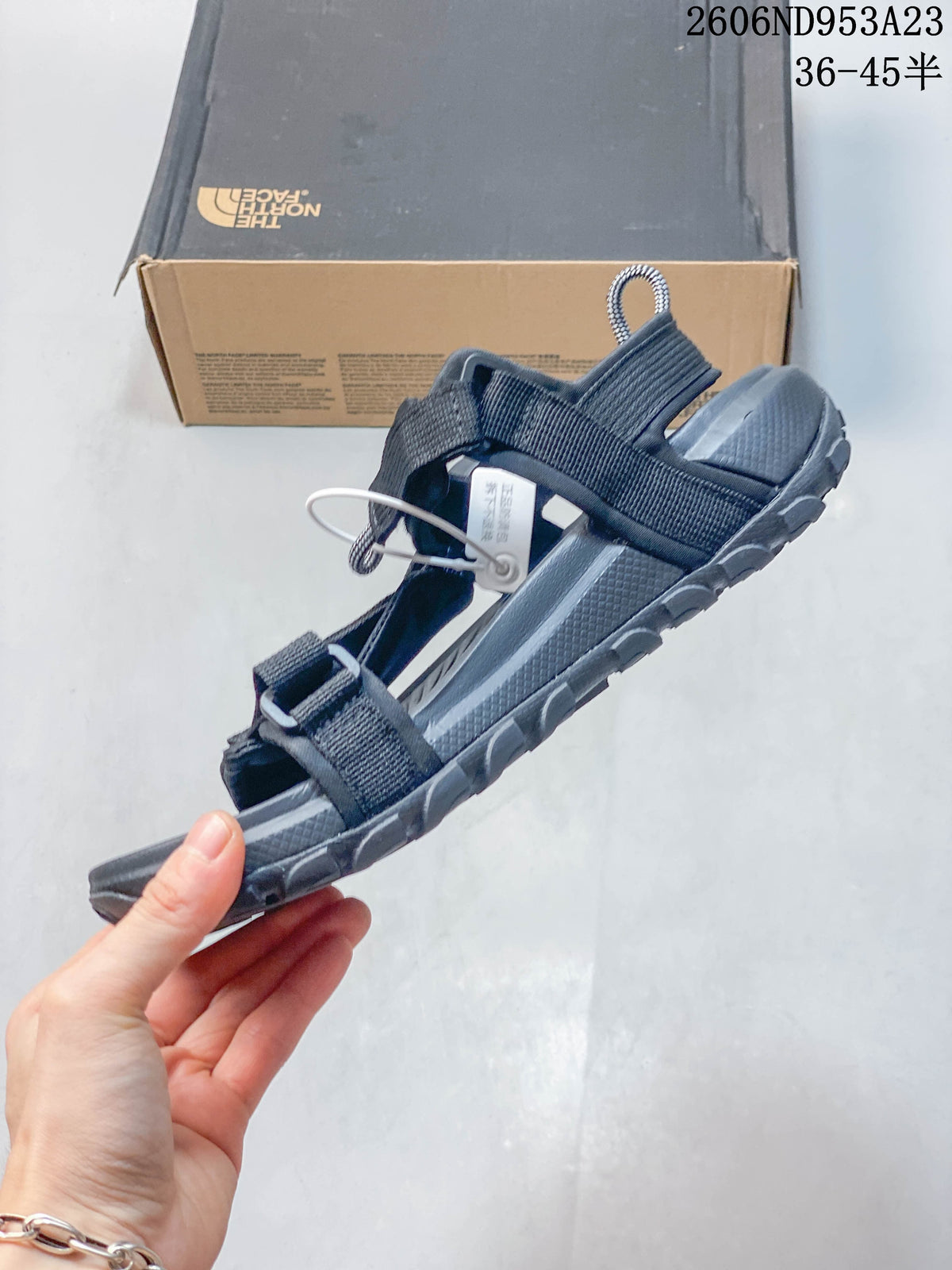 Side view showing the open-toe sandal, adjustable straps, and contoured sole