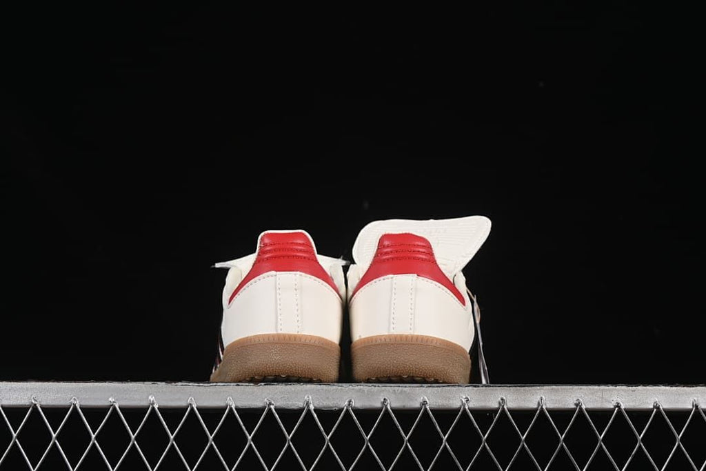 Rear view of the pair showing red heel panels and gum-colored outsoles.
