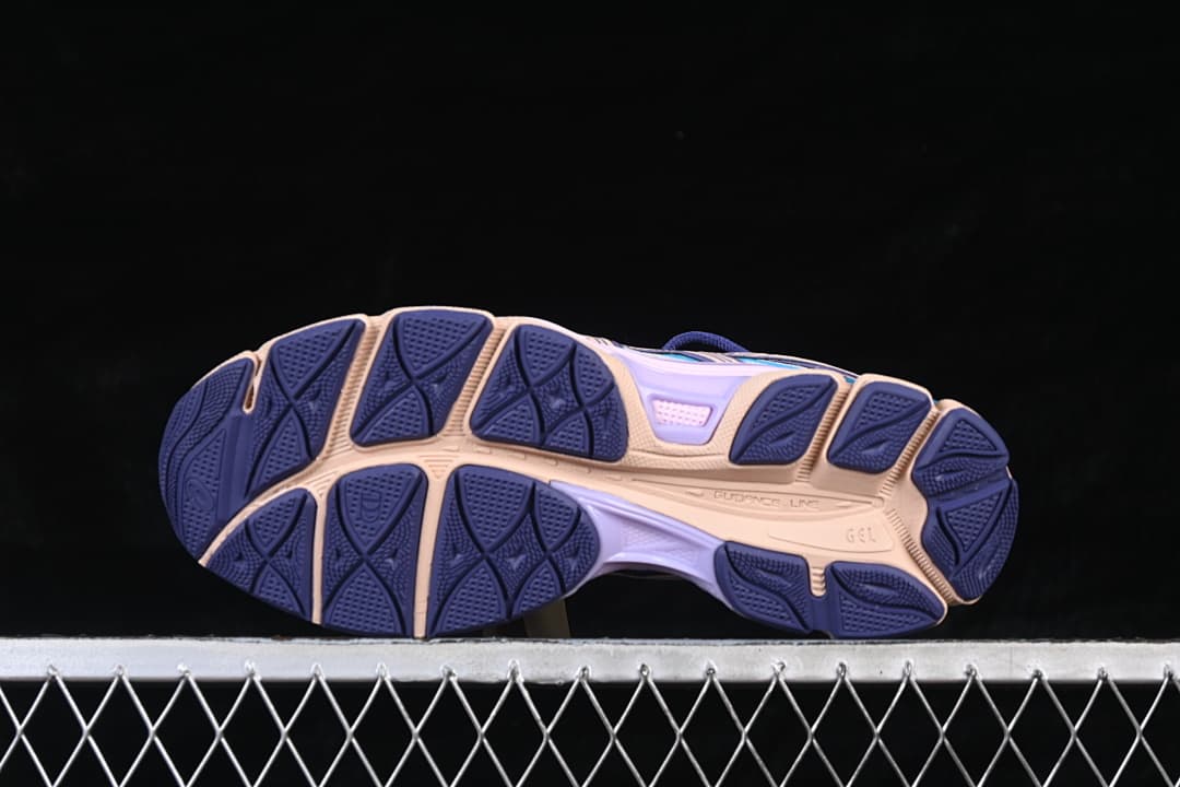 Outsole view showing the segmented tread pattern.