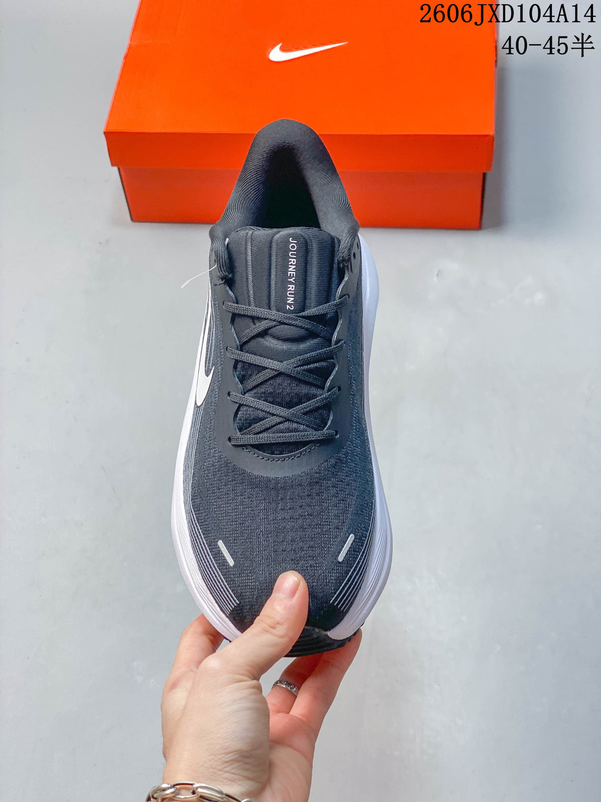 Top view of a gray Nike Journey Run 2 running shoe with dark laces
