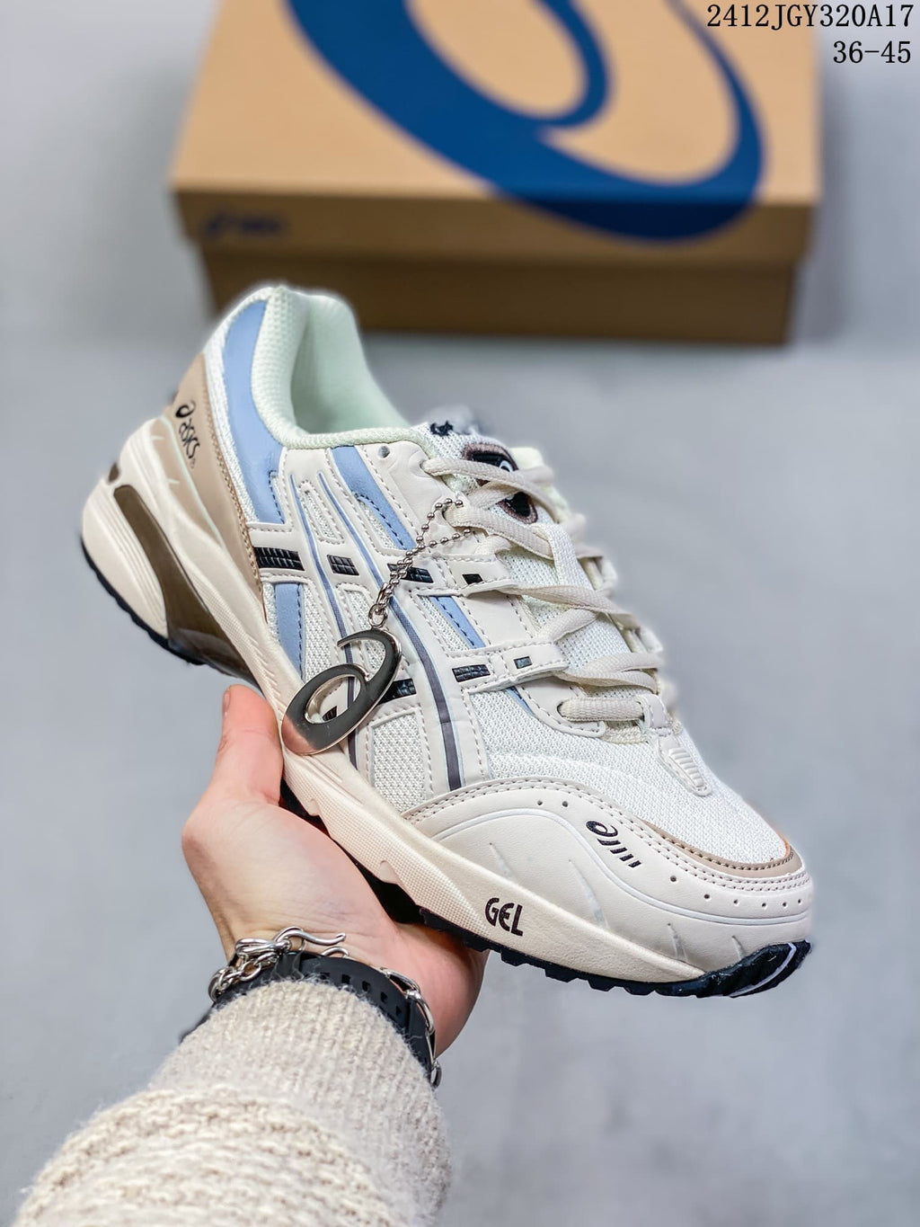 Angled side view of a white and blue ASICS GEL-1090 sneaker; image shows style code 2412JGY320A17 and size range 36–45.