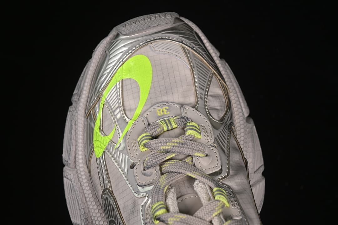 Top view highlighting the laces and fluorescent yellow side detail