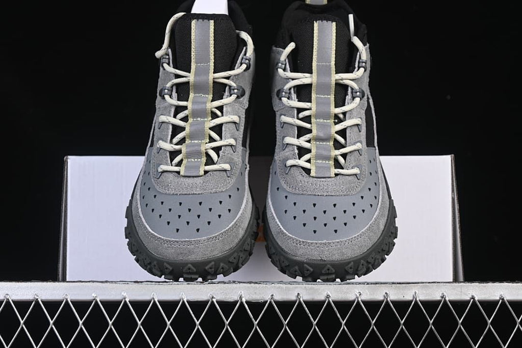 Front view of the pair showing their perforated toe panels and lace-up design.