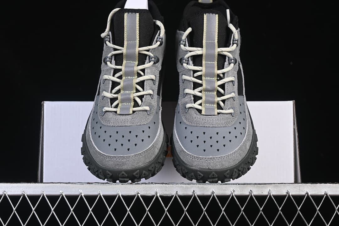 Front view of the pair showing their perforated toe panels and lace-up design.