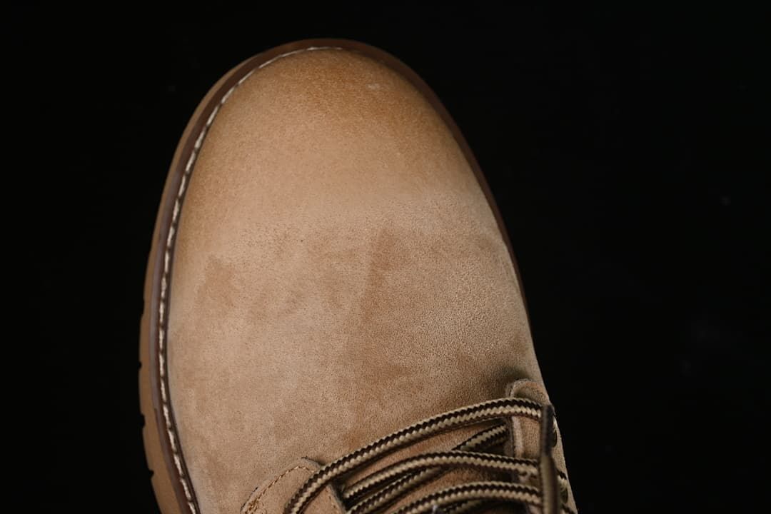 Top view of the beige boot toe and lace area
