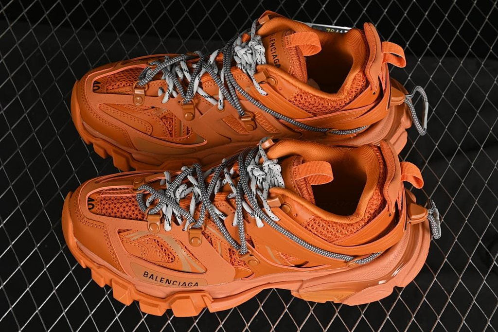 Pair of orange Balenciaga Track sneakers viewed from above