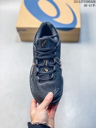 Top view of the dark navy ASICS sneaker showing the laces, tongue branding, and textured upper.