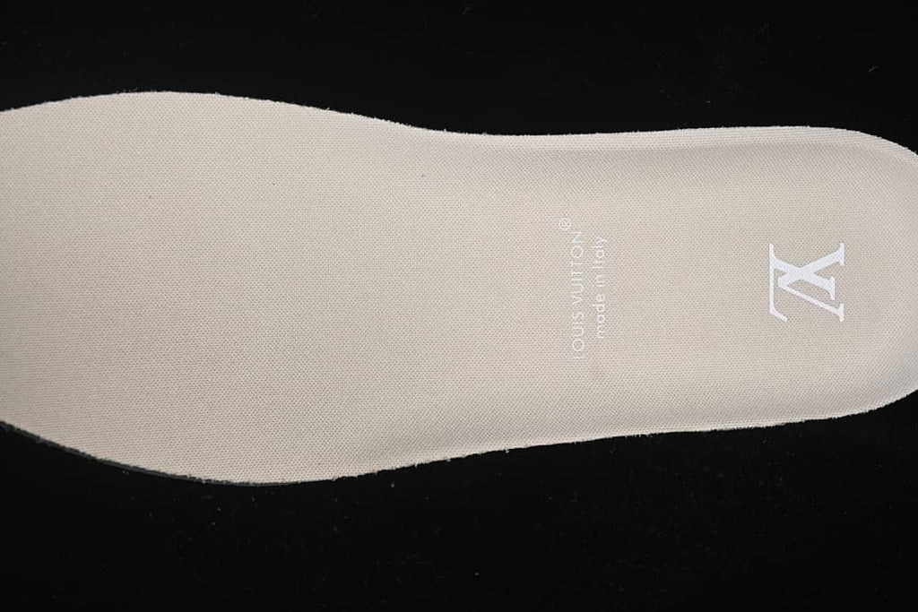 Close-up of beige insole with printed emblem