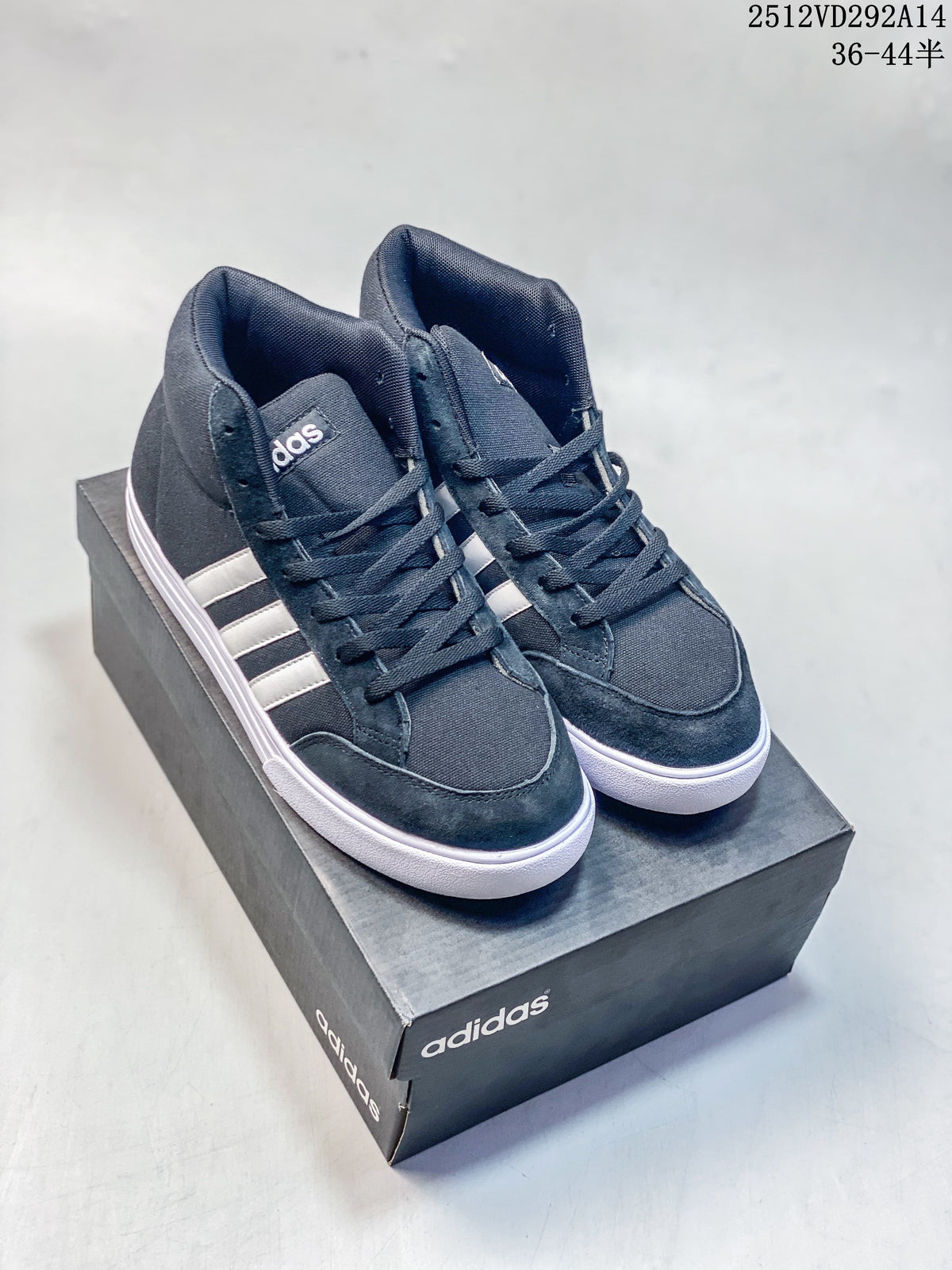 Pair of dark navy Adidas VS Set Mid high-top sneakers with white stripes and soles