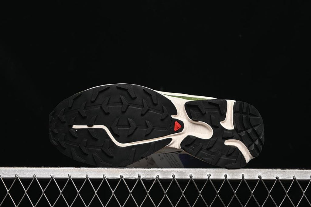 Underside view showing the black lugged outsole.