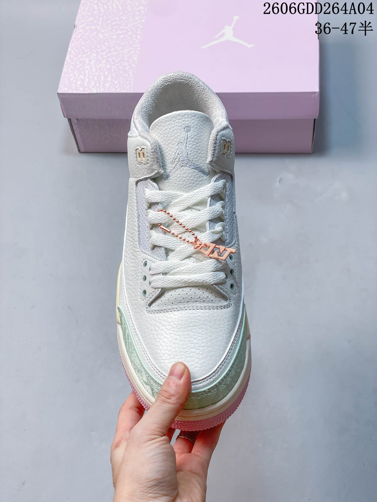 Top view of the sneaker showing white laces and pale green patterned toe accents.