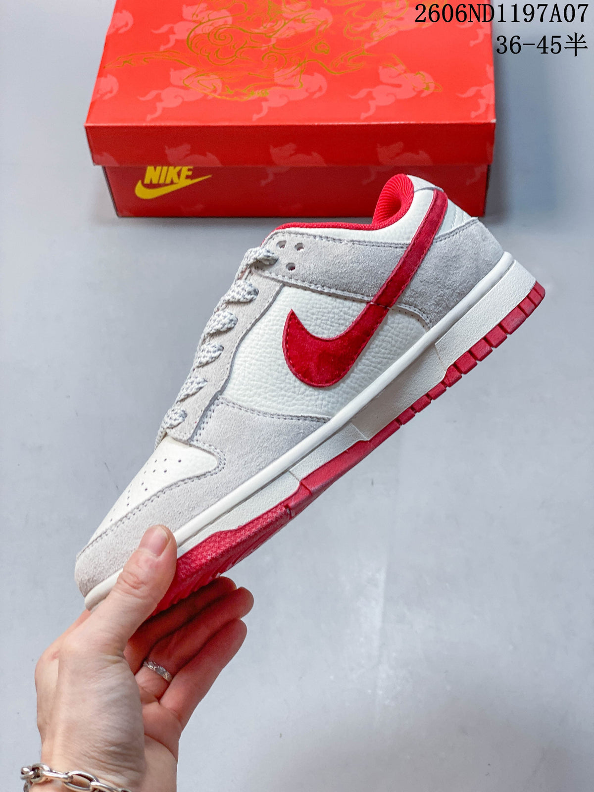 Side view showing the gray and white panels and red Swoosh