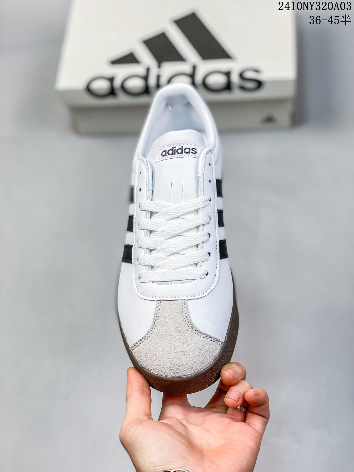 Front view of the sneaker showing white laces and a light gray toe overlay.