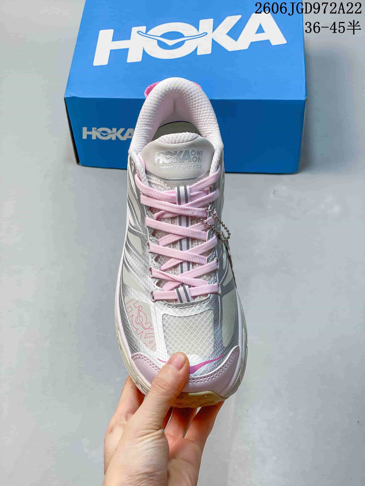 Front view showing the mesh-style toe, pink laces and tongue branding