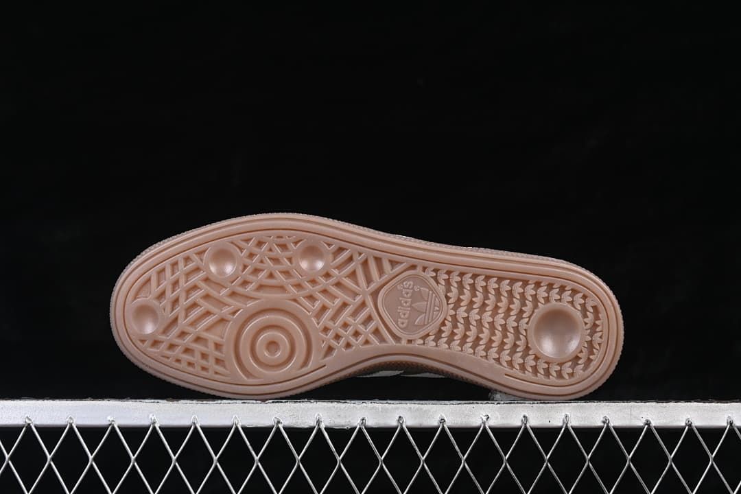 Underside view showing the patterned gum-colored outsole