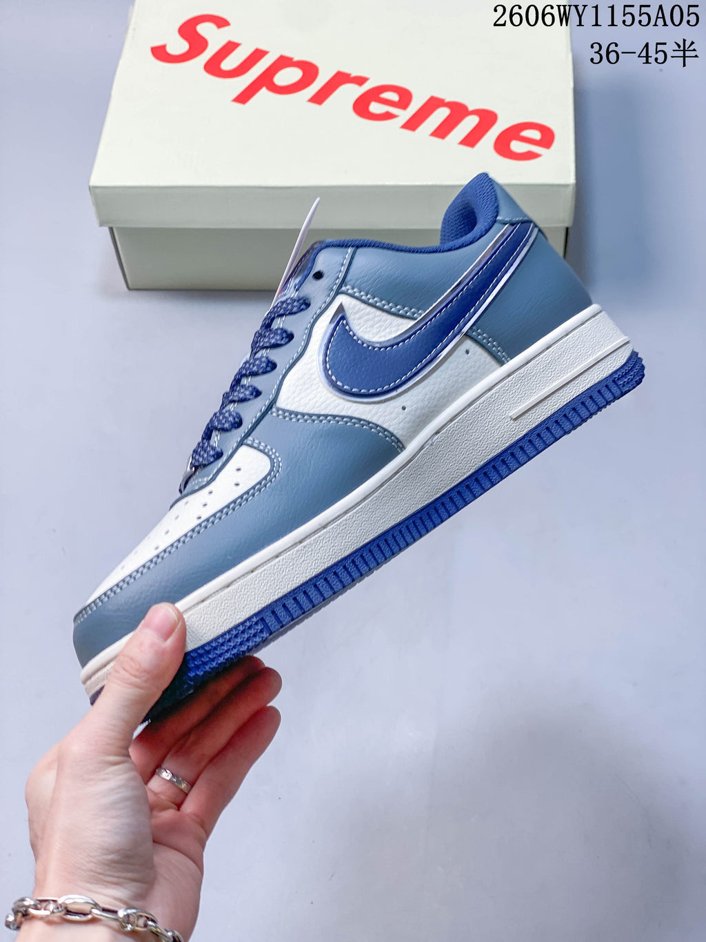 Side profile showing white and blue panels and swoosh