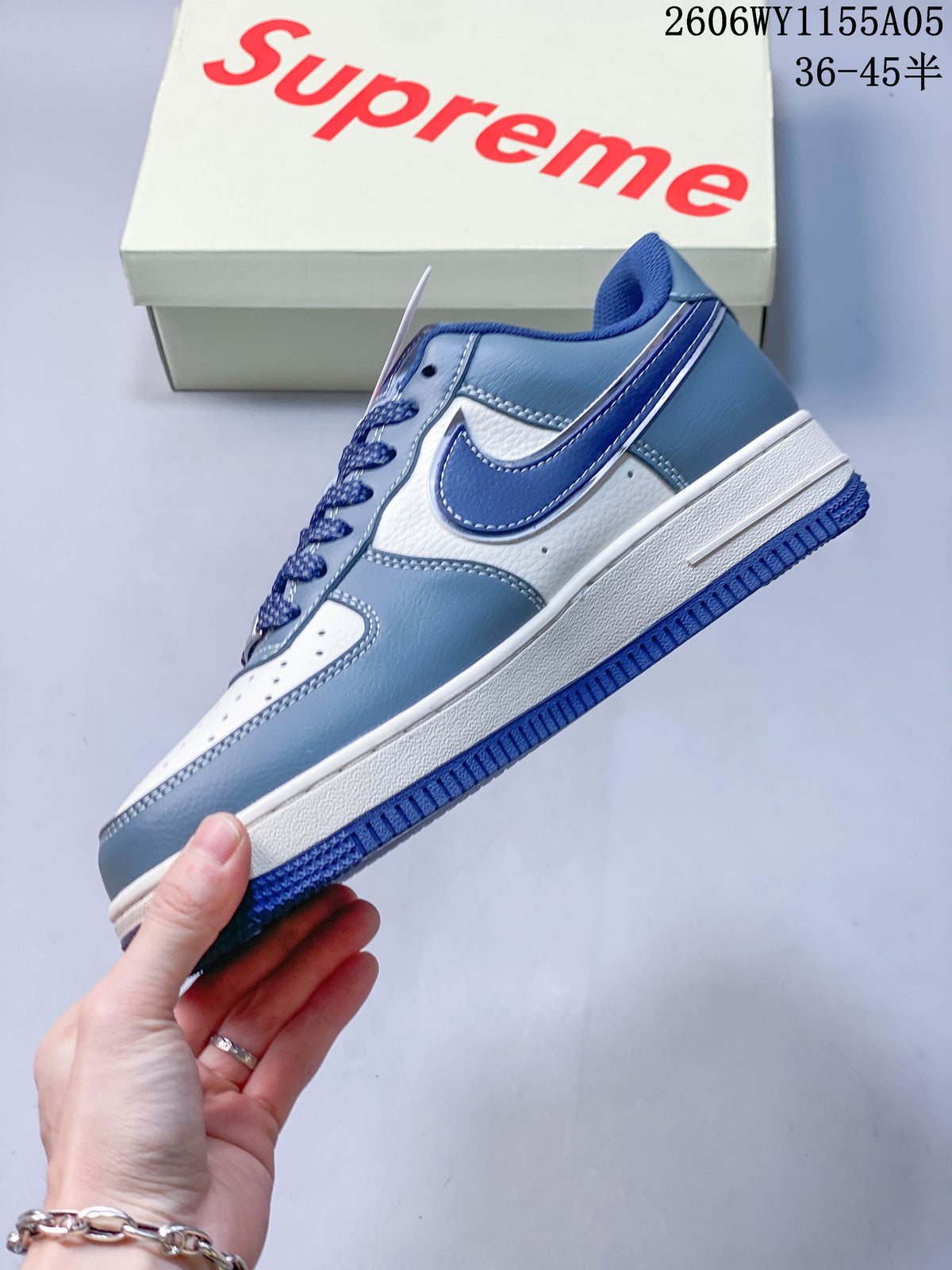 Side profile showing white and blue panels and swoosh