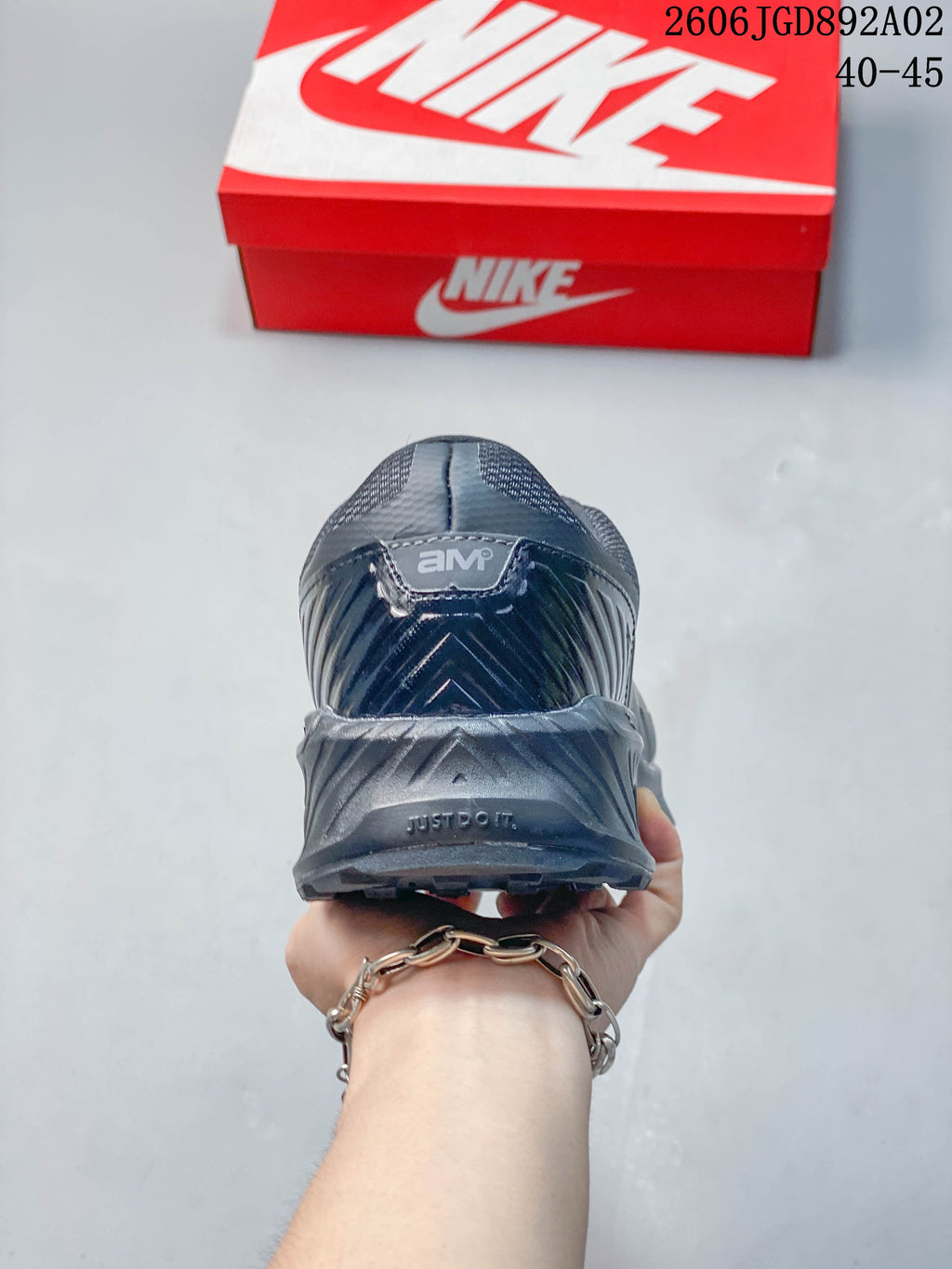 Rear view of a dark gray Nike Air Max BIA shoe