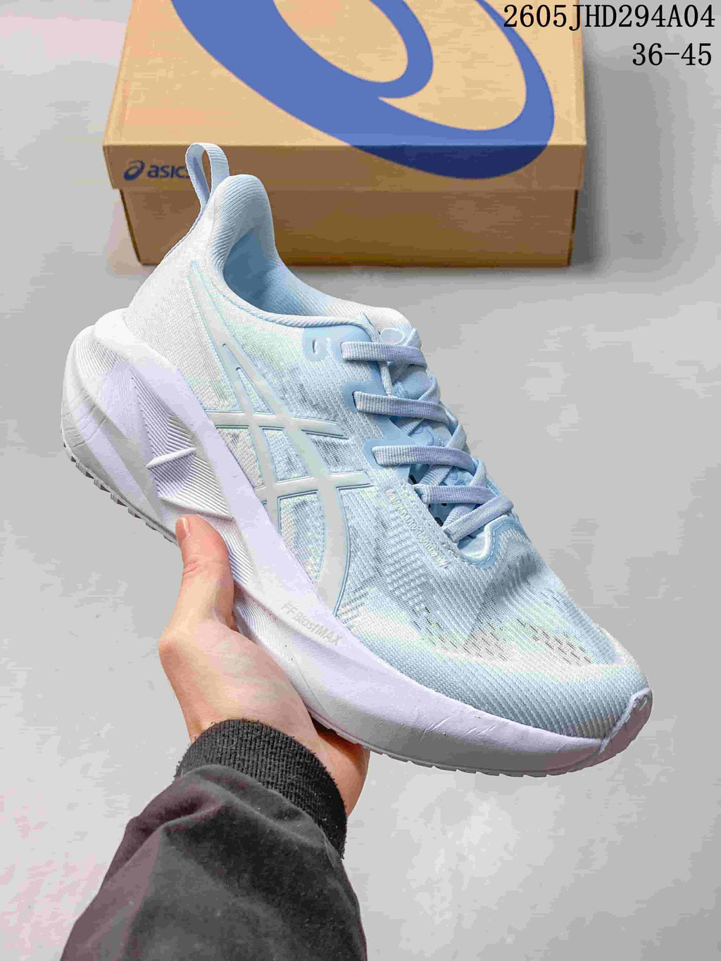 Light blue and white ASICS NOVABLAST 5 LE running shoe