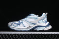 Side view of a white and blue Balenciaga Runner-style sneaker against a dark background