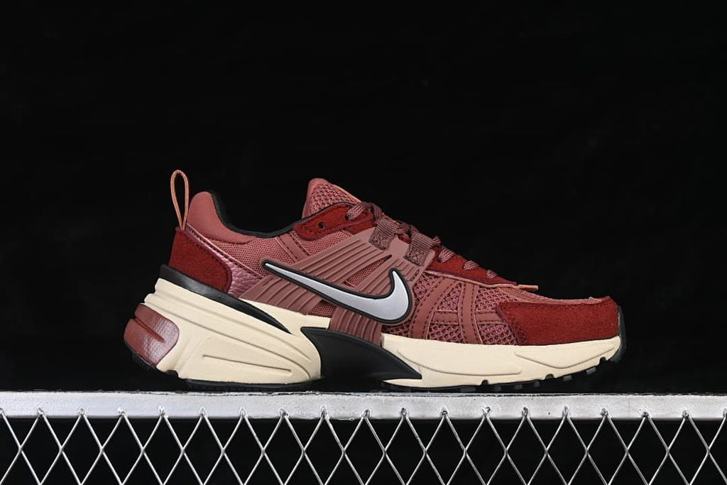 Side profile of a burgundy Nike V2K Run sneaker