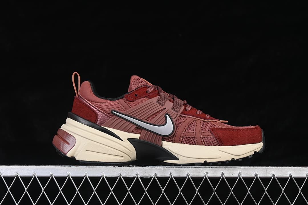 Side profile of a burgundy Nike V2K Run sneaker