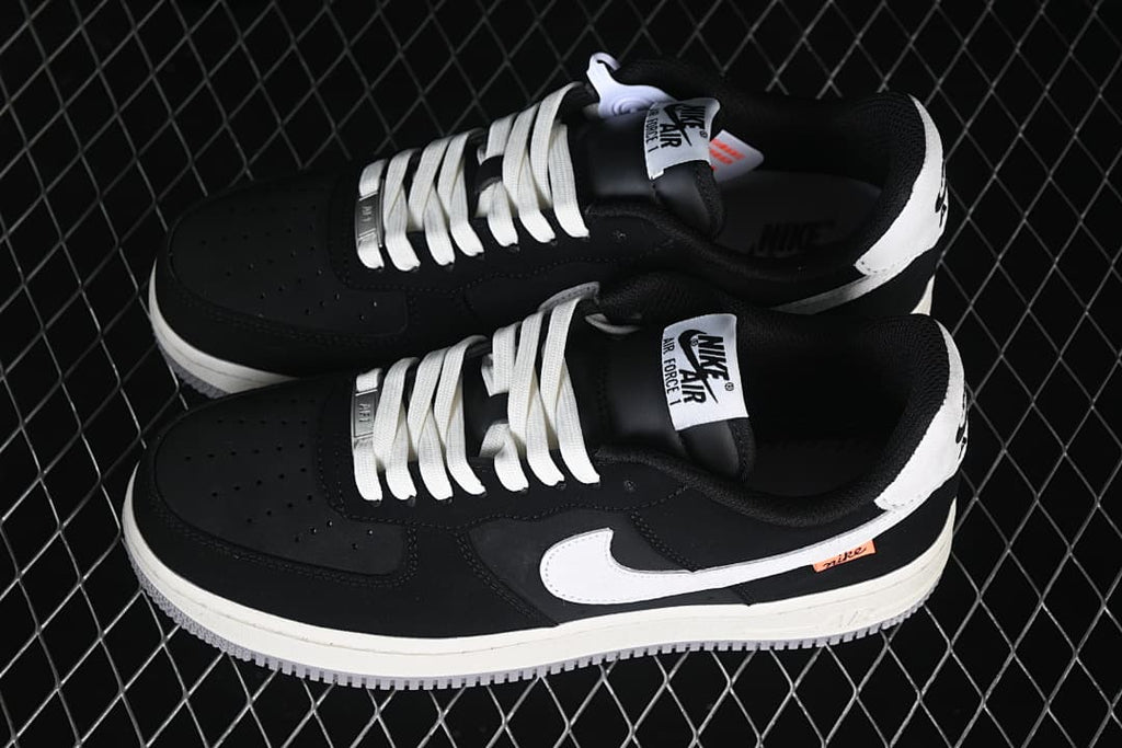 Pair of black and white Nike Air Force 1 '07 Low sneakers