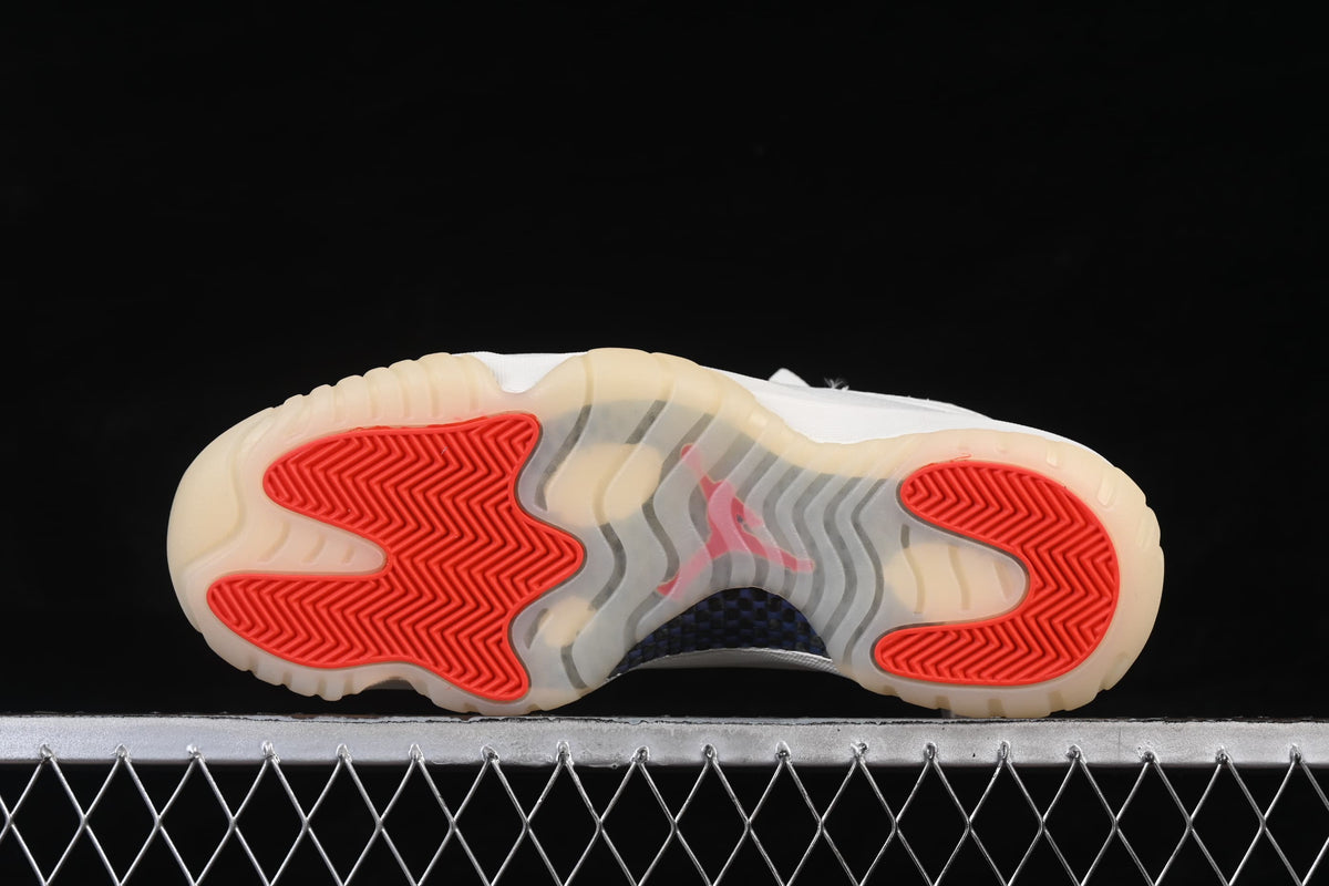 Outsole view showing translucent sections and red traction areas.