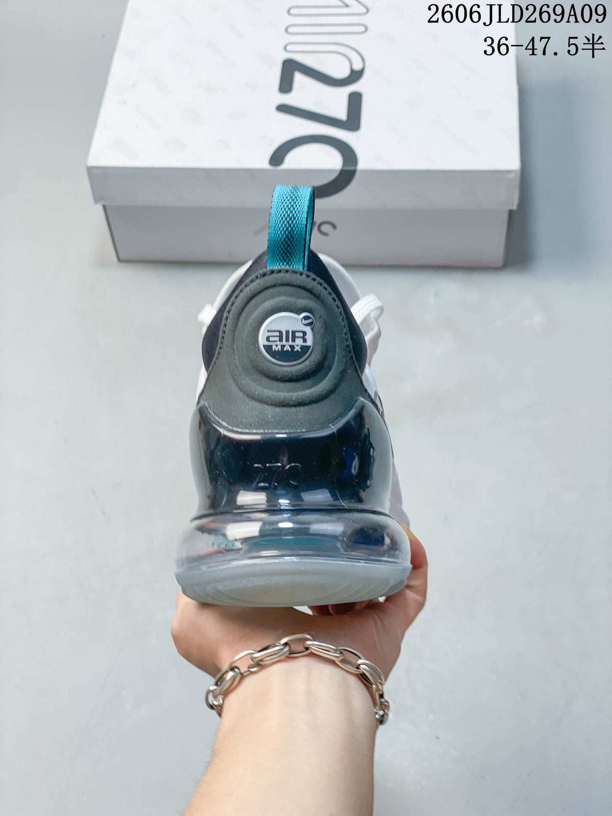 Rear view of a Nike Air Max 270 sneaker showing the heel cushioning unit and pull loop