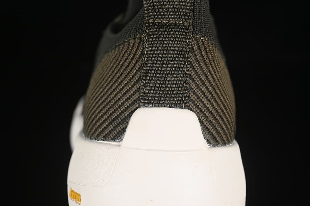 Rear view showing the heel pull tab and white sole