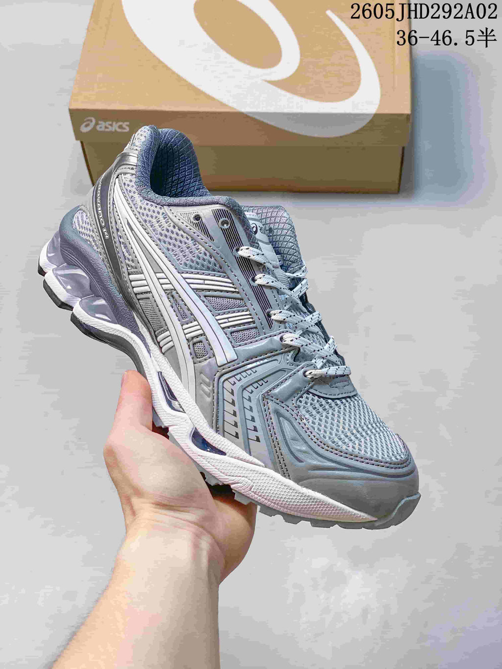 ASICS GEL-KAYANO 14 sneaker in gray and silver with layered mesh panels