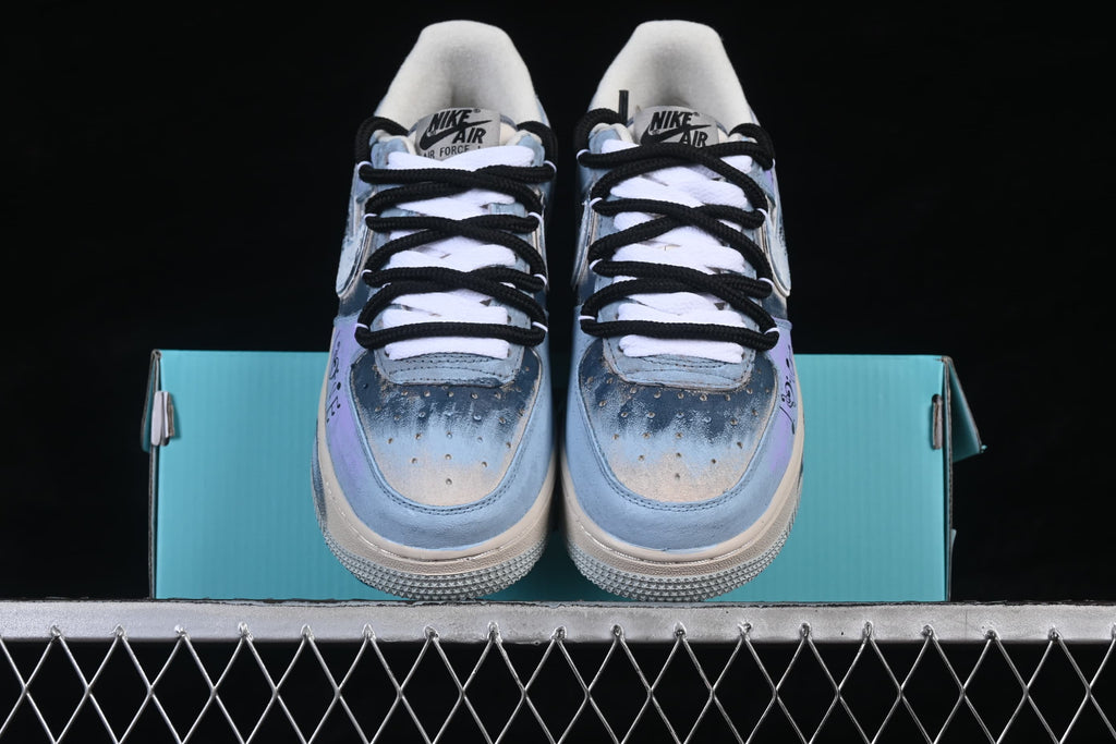 Front view of the pair showing blue-toned toe boxes and contrasting laces