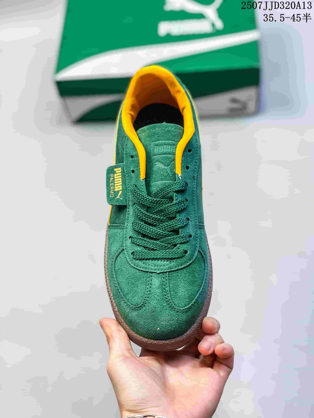 Top view of a green lace-up PUMA sneaker with yellow collar trim.